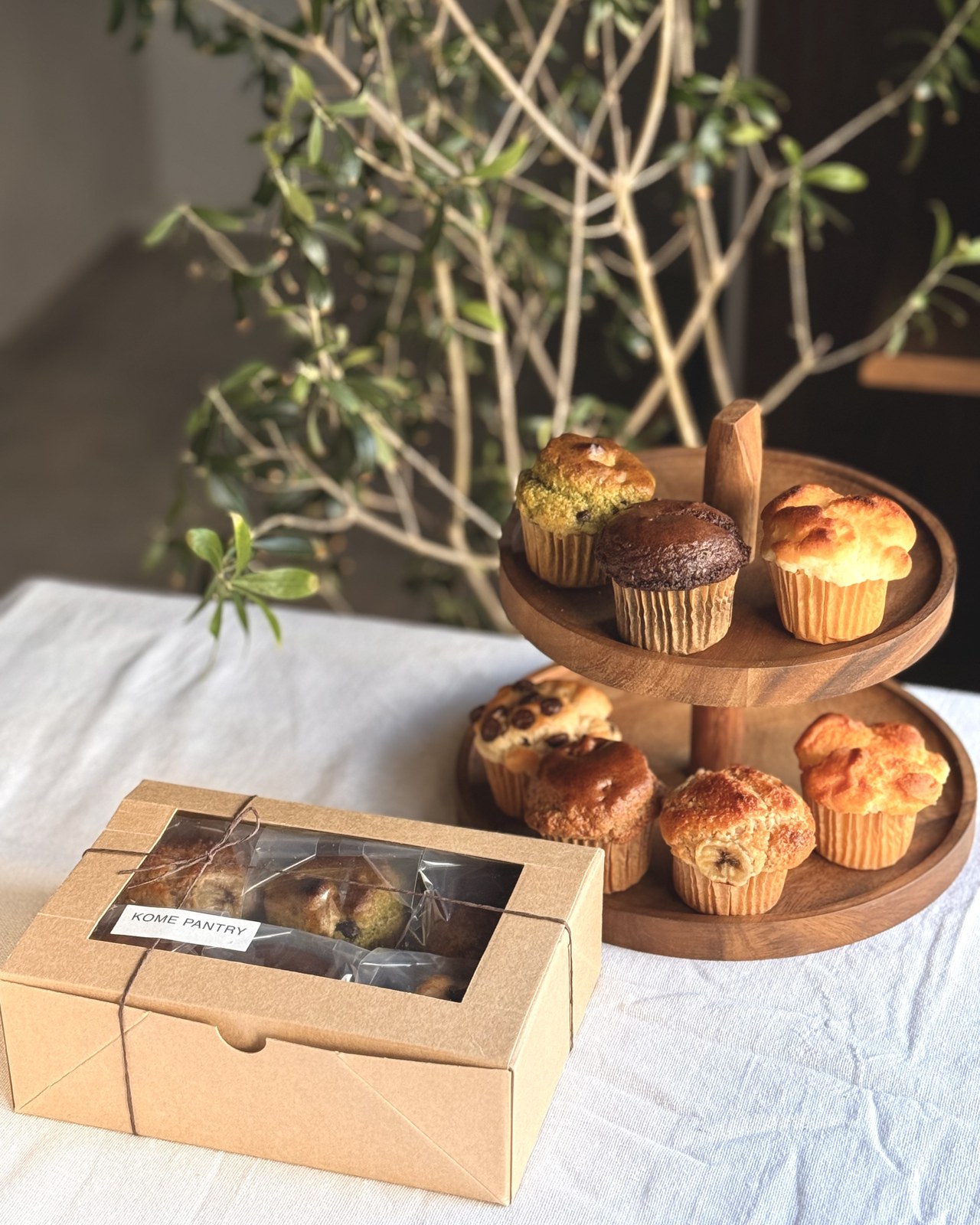 Kome Pantry boxed muffins and tiered display — wholesale packaging